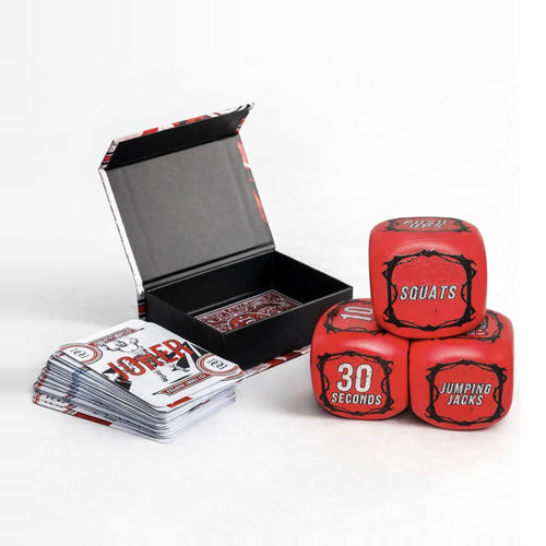 The full system in one shot: the deck in its magnetic box with cards, plus the three workout dice